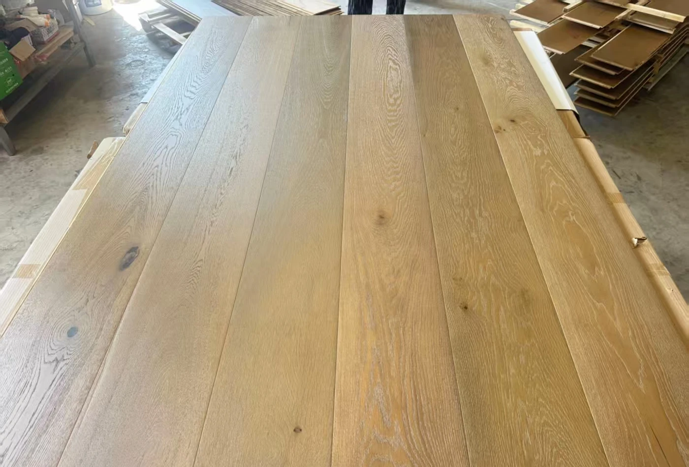Several white oak boards laid together to review tones, knots and grain