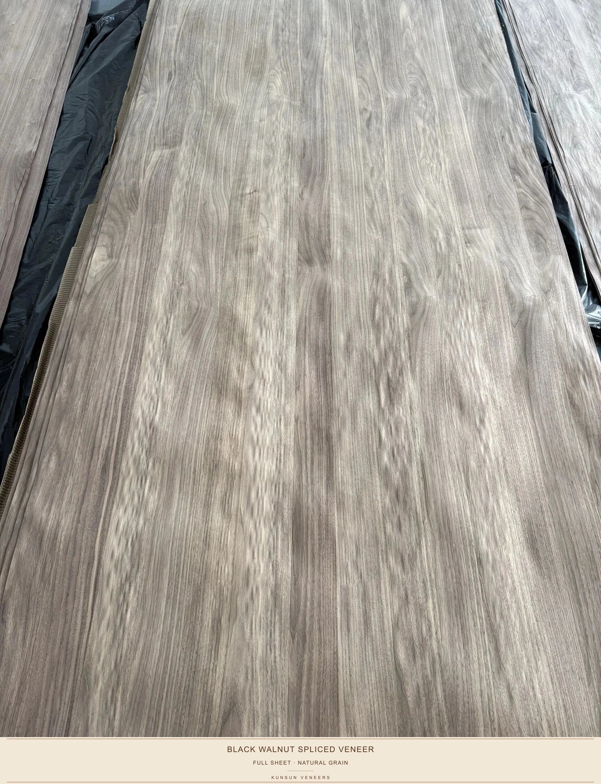 Full-sheet view of spliced black walnut veneer facing, showing the natural strip-to-strip grain variation.