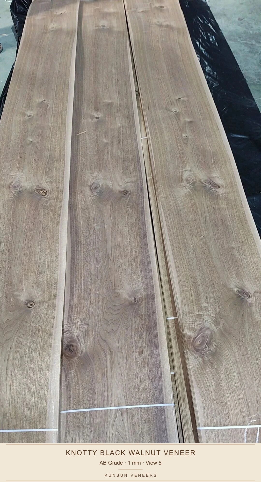 View 5 of actual AB black walnut thick veneer bundles, showing natural knots, openings and grain variation.